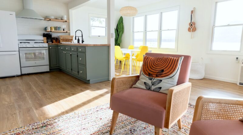 a kitchen with a chair and a table in it